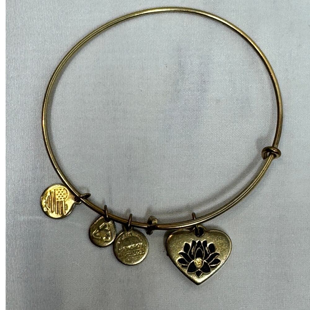 Alex‎ and Ani Lotus Peace Petals charm bangle bracelet in a gold-tone finish.
